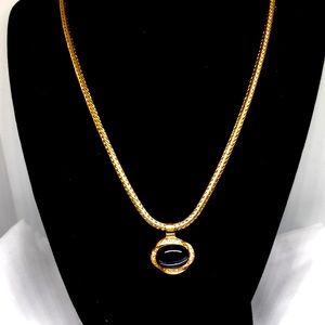 Roman Gold clear crystal and dark gray Cabochon necklace.
